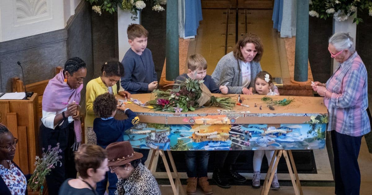 decorating a casket with flowers and paint