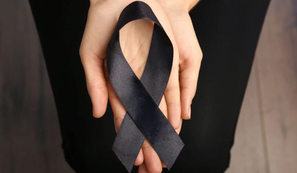black ribbon in hands