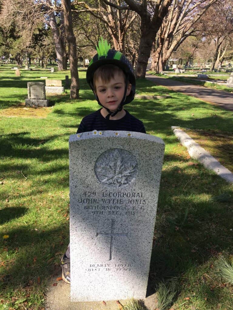 Child with gravestone