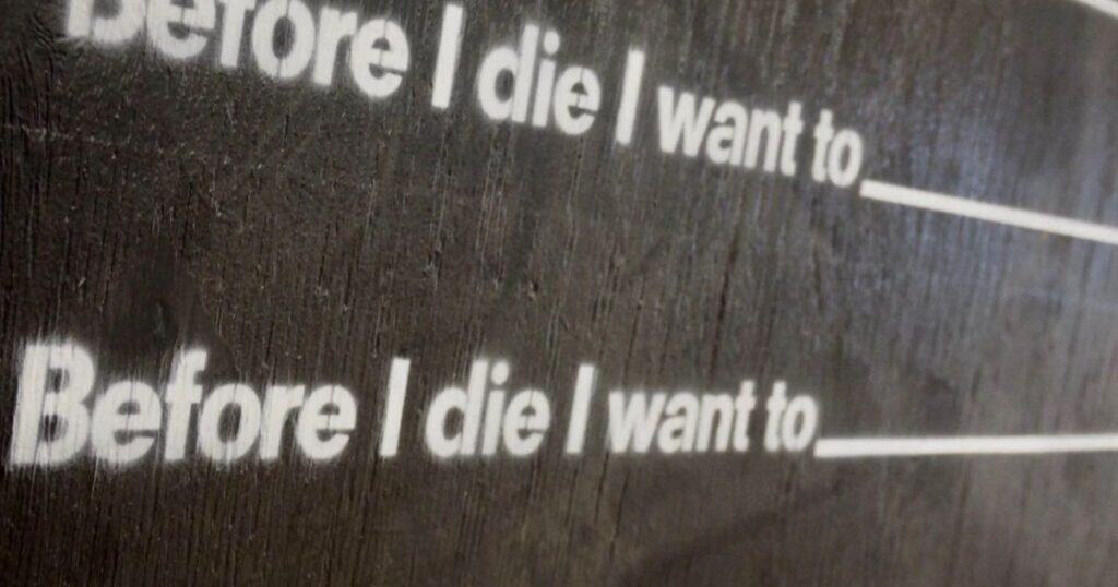 blackboard with writing prompt: "before I die i want to..."